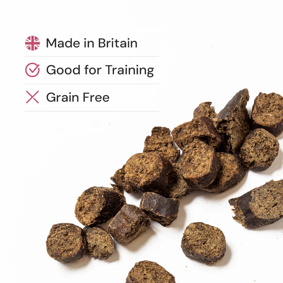 Dog treats on a white background with text indicating 'Made in Britain', 'Good for Training', and 'Grain Free'.